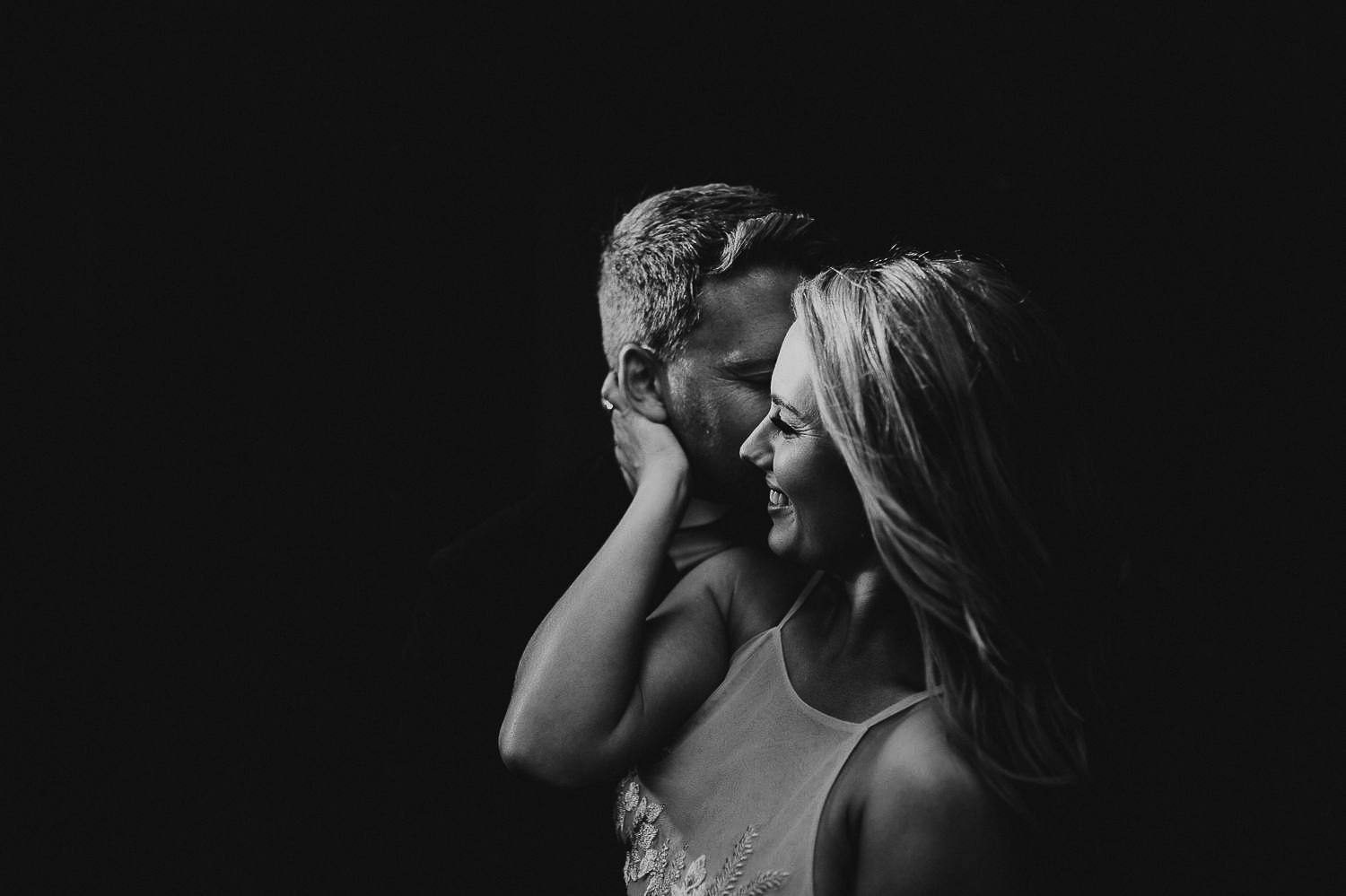 Bride touching grooms face